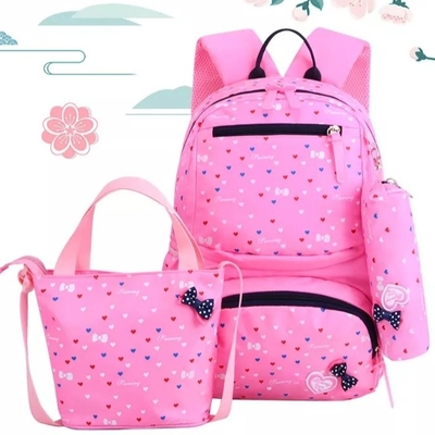 Les sacs à dos pour des filles instruisent les enfants mignons baladent la gamelle isolée par Bookbags ont placé le sac